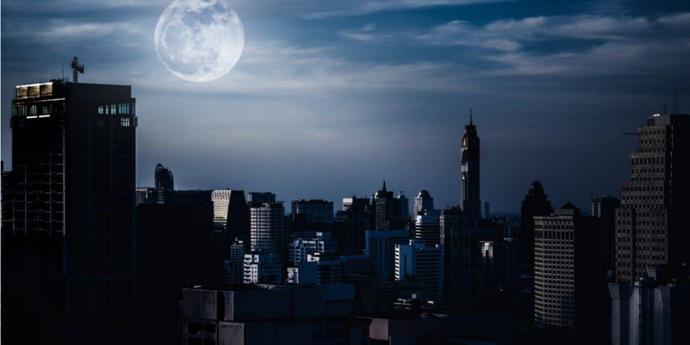 Dark skyscrapers in moonlight