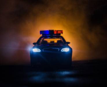 Police car menacing fog