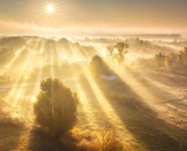 Sun spilling across fields